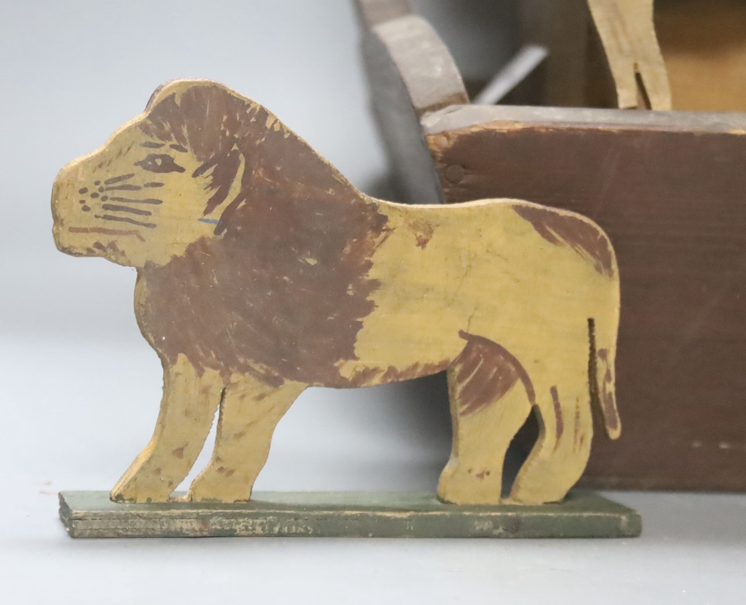 An early 20th century Steiff pull-along horse on wheels, boot button eyes and wood wool filling, button in left ear, 40cm long and a late 19th century painted plywood Noah's Ark with animals